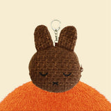 An officially licensed Miffy Melanie brown tweed pouch featuring sleeping embroidered eyes and an attached silver clip.