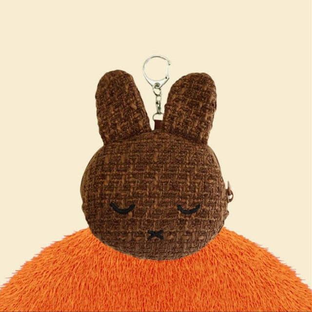 An officially licensed Miffy Melanie brown tweed pouch featuring sleeping embroidered eyes and an attached silver clip.