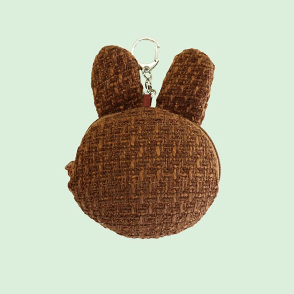 An officially licensed Miffy Melanie brown tweed pouch featuring sleeping embroidered eyes and an attached silver clip.