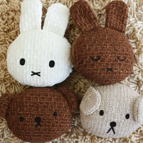An officially licensed Miffy Melanie brown tweed pouch featuring sleeping embroidered eyes and an attached silver clip.