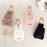 An officially licensed Miffy plush mini backpack pouch keychain in brown, ivory, pink, and black, featuring a gold bunny shaped clip.