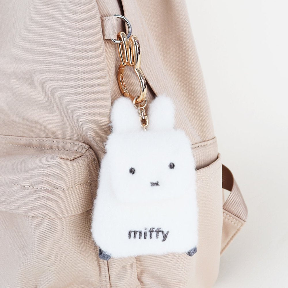 An officially licensed Miffy plush mini backpack pouch keychain in brown, ivory, pink, and black, featuring a gold bunny shaped clip.