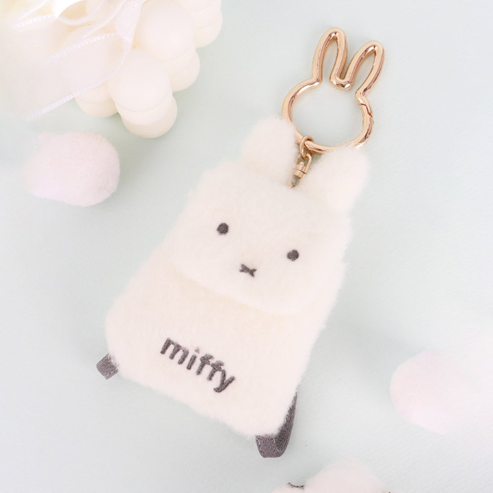 An officially licensed Miffy plush mini backpack pouch keychain in brown, ivory, pink, and black, featuring a gold bunny shaped clip.