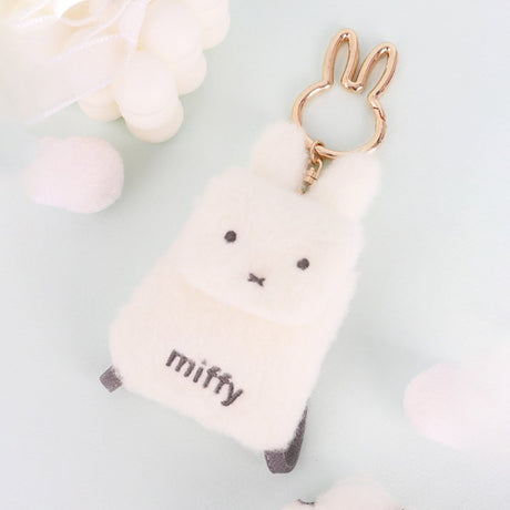 An officially licensed Miffy plush mini backpack pouch keychain in brown, ivory, pink, and black, featuring a gold bunny shaped clip.