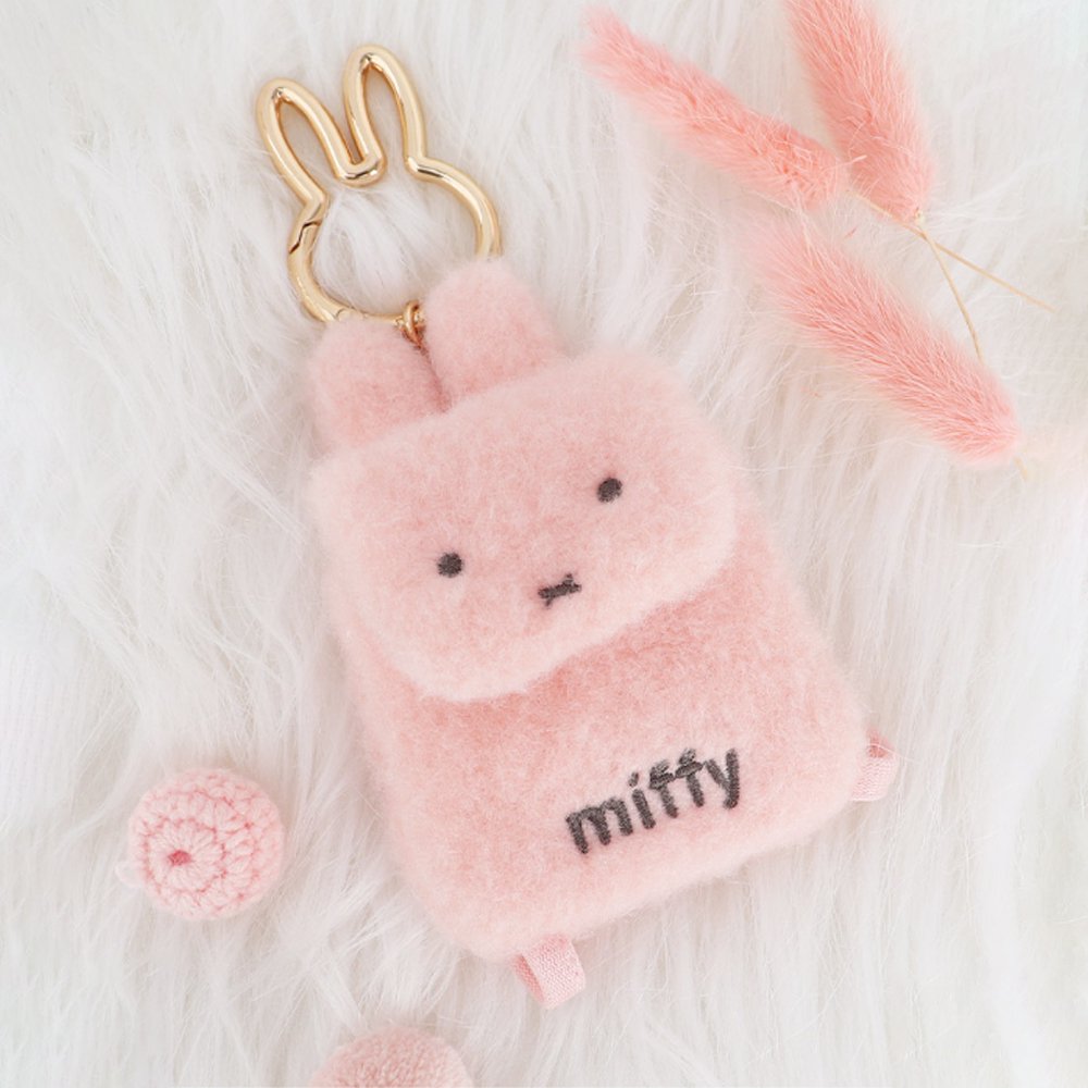 An officially licensed Miffy plush mini backpack pouch keychain in brown, ivory, pink, and black, featuring a gold bunny shaped clip.