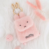 An officially licensed Miffy plush mini backpack pouch keychain in brown, ivory, pink, and black, featuring a gold bunny shaped clip.
