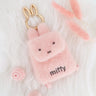 An officially licensed Miffy plush mini backpack pouch keychain in brown, ivory, pink, and black, featuring a gold bunny shaped clip.