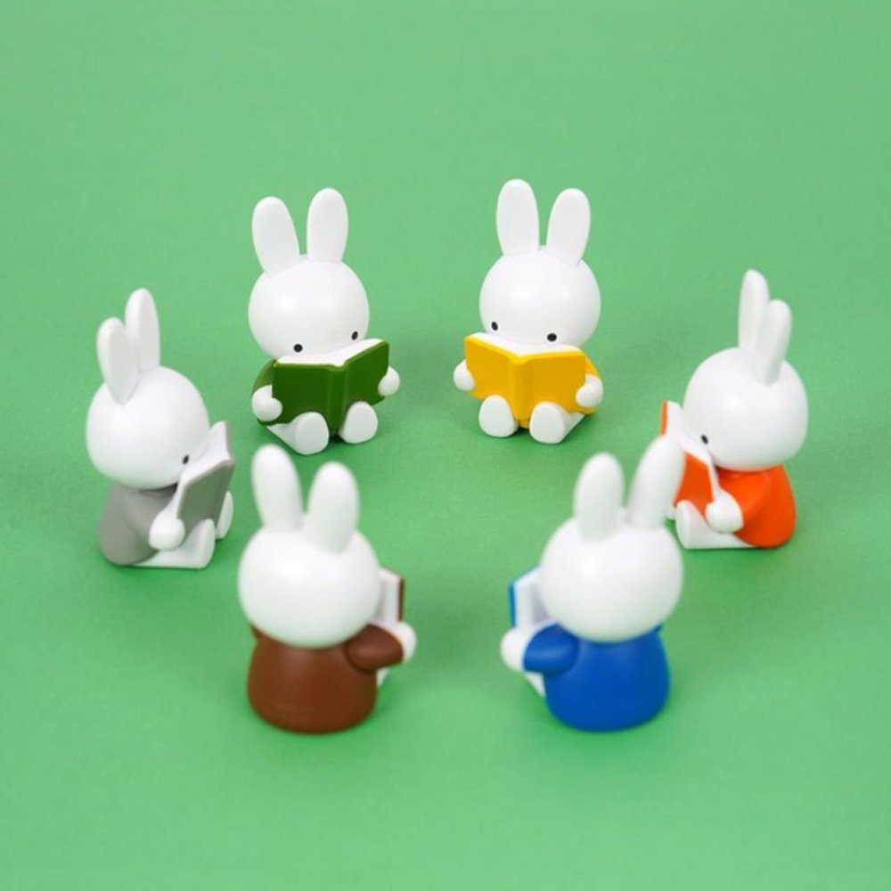 Officially licensed Miffy Reading a Book Mini Figure Blind Box featuring Miffy sculpted sitting down and holding an open book in various colors