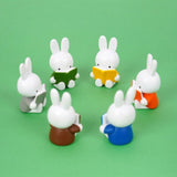 Officially licensed Miffy Reading a Book Mini Figure Blind Box featuring Miffy sculpted sitting down and holding an open book in various colors