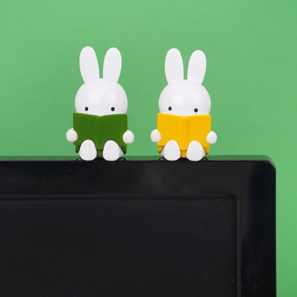 Officially licensed Miffy Reading a Book Mini Figure Blind Box featuring Miffy sculpted sitting down and holding an open book in various colors