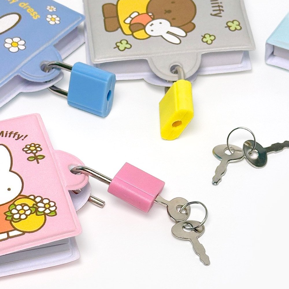 An officially licensed collection of Miffy secret mini notebooks in soft pink, light blue, blue, and grey. Each notebook features a padded cover with Miffy or Boris Bear illustrations, a silver ball chain, and a color-coordinated miniature padlock with keys.