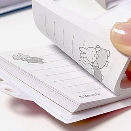 An officially licensed collection of Miffy secret mini notebooks in soft pink, light blue, blue, and grey. Each notebook features a padded cover with Miffy or Boris Bear illustrations, a silver ball chain, and a color-coordinated miniature padlock with keys.