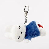 Officially licensed Miffy sleeping plush keychain featuring embroidered closed eyes and an 'X' mouth. Miffy plush wearing blue top. Ideal collectible bag charms, backpack zipper pulls or gift.
