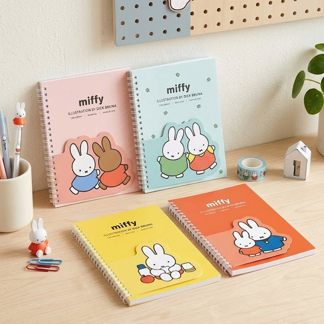 Four colorful spiral notebooks in pink, green, yellow, and orange, each featuring an officially licensed Miffy memo pad attached to the front cover.