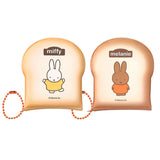 Officially licensed Miffy memo pads shaped like slices of toast. The pads feature a soft tan cover with character illustrations and include orange ball chains.