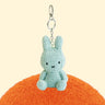 Four officially licensed Miffy textured tweed plush keychains lined up in pink, sage green, cream, and navy blue with attached silver keyrings