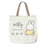 An officially licensed Miffy canvas tote bag with zipper closure, the bag has a grid pattern with Miffy and "Good Times Forever" text.