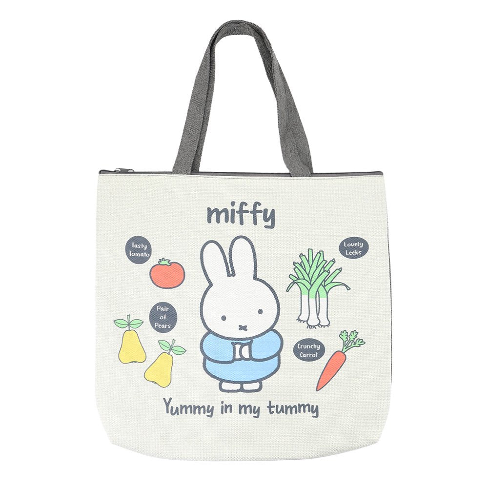 An officially licensed Miffy canvas tote bag with zipper closure, the bag shows Miffy surrounded by vegetables like carrots and leeks with "Yummy in my Tummy" text.
