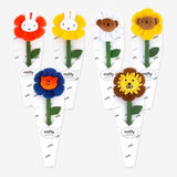 A collection of Miffy Friends Flower Plushies stuffed animals in various colors, each designed to look like a flower with animal faces in the center.