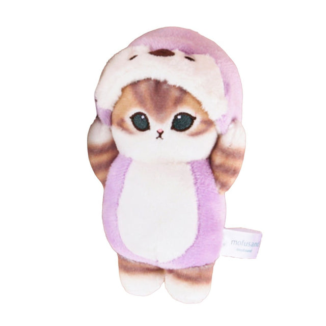 An officially licensed Mofusand plush cat keychain featuring a brown cat with big green eyes wearing a light purple animal hood.