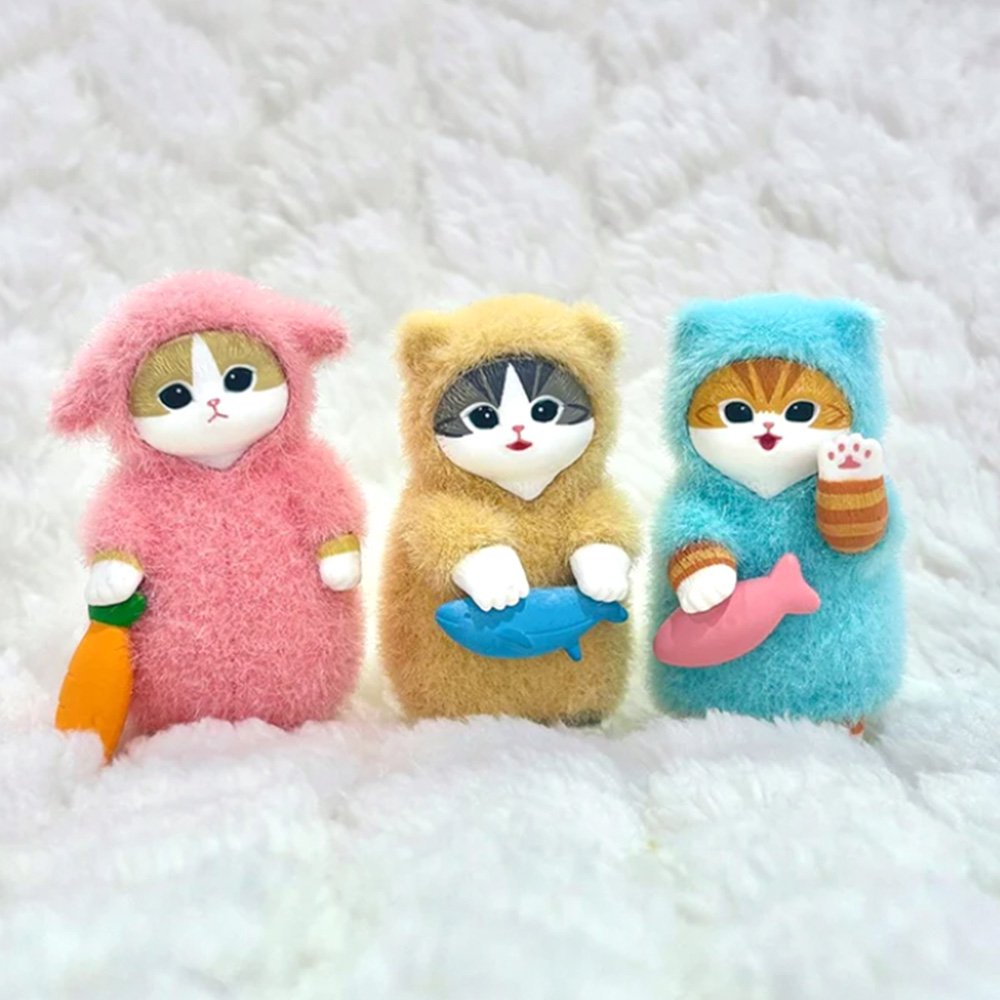 Three officially licensed Mofusand figures each in fluffy pajamas of pink, yellow, and blue color