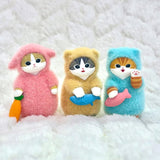 Three officially licensed Mofusand figures each in fluffy pajamas of pink, yellow, and blue color