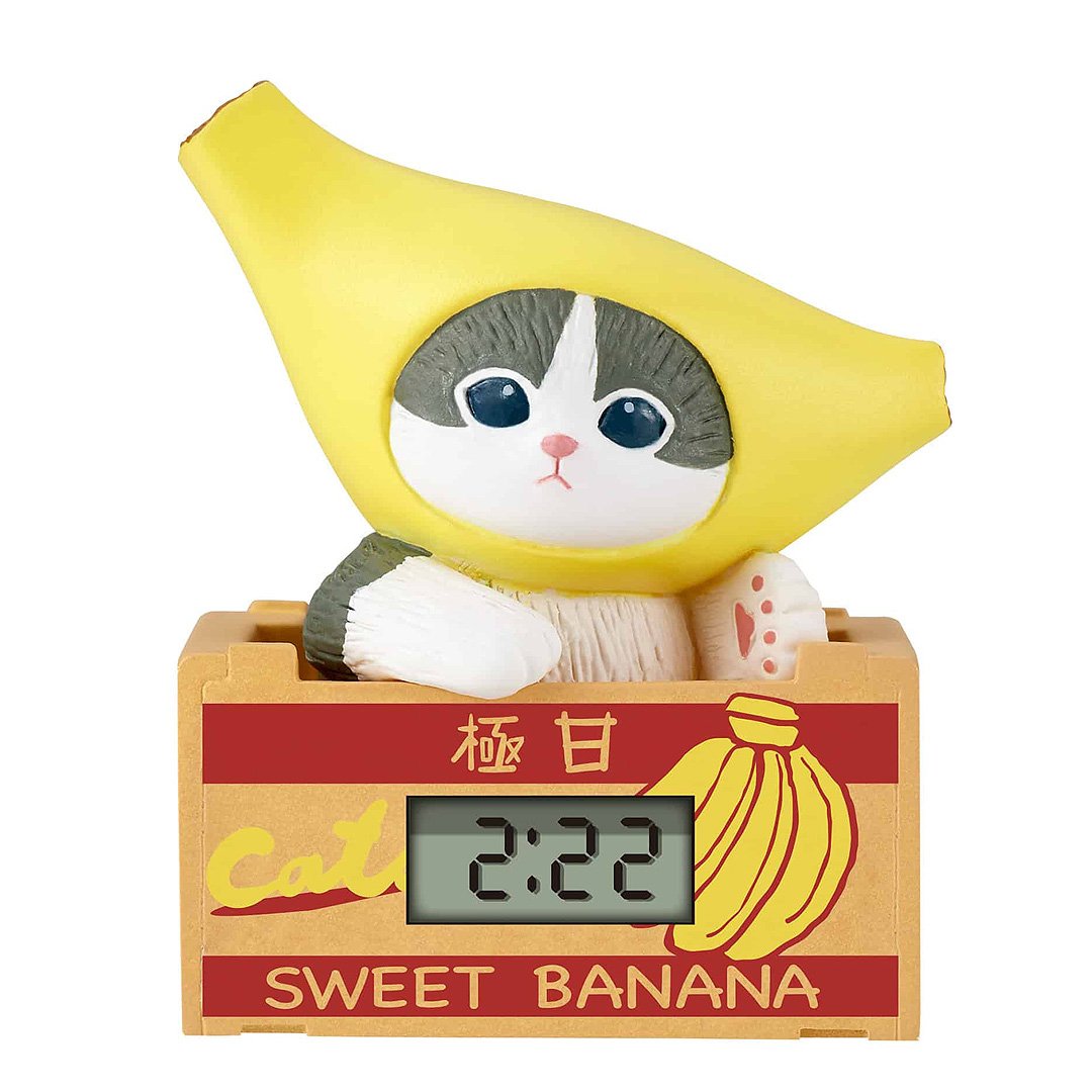 Mofusand blind box miniature clock, a collectible cat figure in a banana costume, ideal for kawaii Japanese stationery and desk accessories.