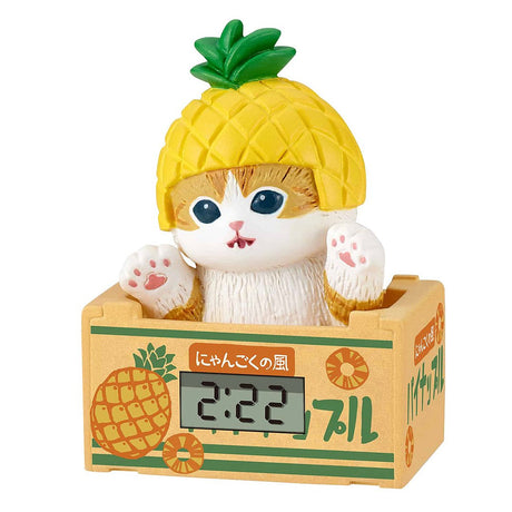 Mofusand blind box miniature clock, a collectible cat figure in a pineapple costume, ideal for kawaii Japanese stationery and desk accessories.