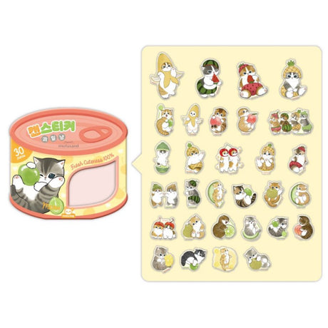 An officially licensed Mofusand sticker set in an orange and yellow tin shaped like a cat food can. The label features a kitten playing with a green grape and a window showing several fruit-themed cat stickers inside.