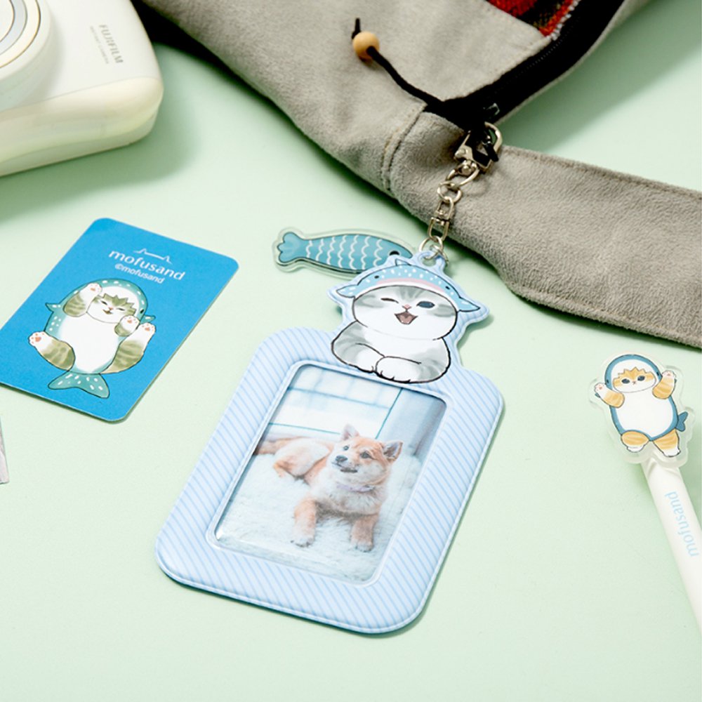 Officially licensed Mofusand collection of three ID card holder keychains featuring cute cat illustrations with matching acrylic charms and secure metal clasps