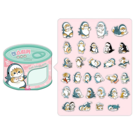 An officially licensed Mofusand sticker set packaged in a pink and teal tin designed to look like a cat food can. A clear window on the front reveals several die-cut stickers of cats in shark costumes, with "30 pieces" and "Fresh Cuteness 100%" printed on the label.