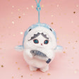An officially licensed Mofusand shark cat plush keychain featuring a fluffy blue tabby kitten wearing a blue shark onesie with embroidered details