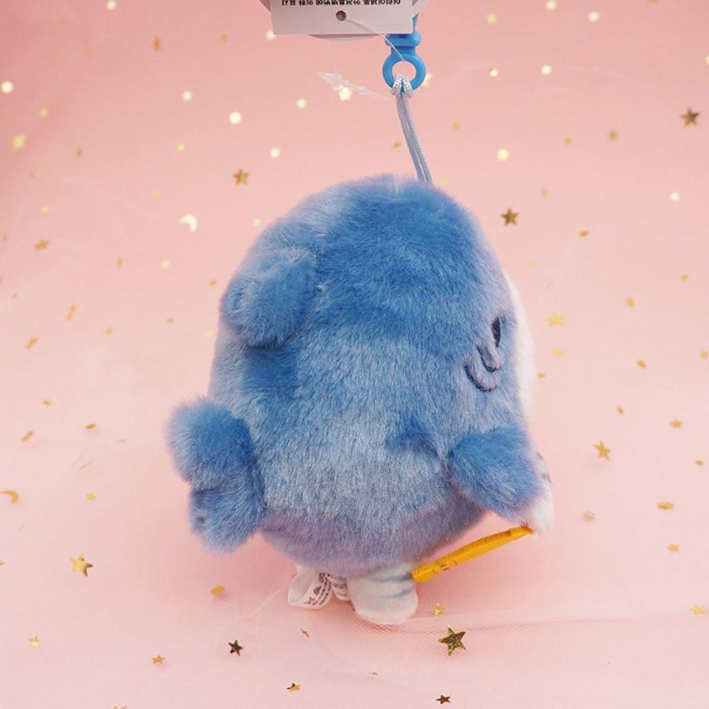 An officially licensed Mofusand shark cat plush keychain featuring a fluffy gray tabby kitten wearing a blue shark onesie with embroidered details