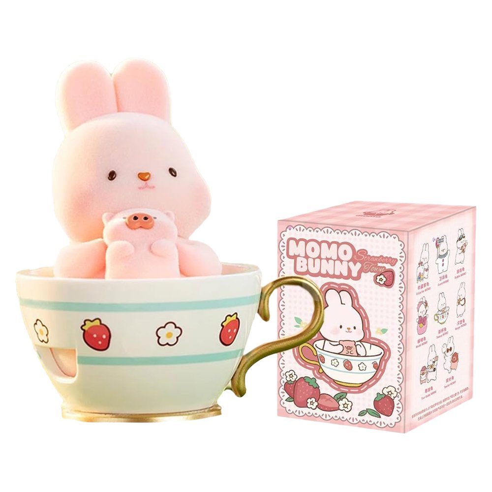 A group of officially licensed Momo Bunny Strawberry Town figures displayed in a miniature outdoor garden setting. The pink bunnies are dressed in various cute outfits, including a snowman suit, a pilot cap, and one sitting inside a strawberry-patterned teacup.