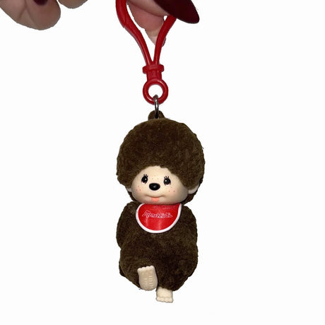 An exclusive set of officially licensed Sekiguchi's Monchhichi flocked character backpack hanger keychains in the blind boxes.
