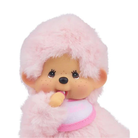 Officially licensed Monchhichi plush , shown against a white background. The plush dolls are pink with fluffy bodies, ABS faces, and are posed sucking his thumbs. They each wear a small embroidered bib.