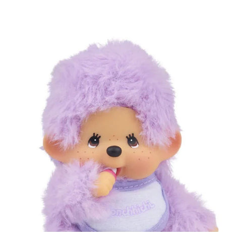 Officially licensed Monchhichi plush , shown against a white background. The plush dolls are purple with fluffy bodies, ABS faces, and are posed sucking his thumbs. They each wear a small embroidered bib.