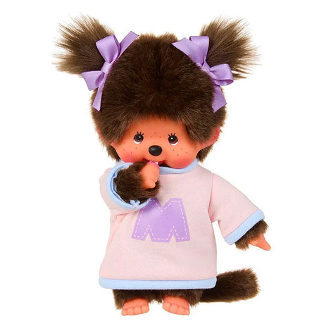 Official Licensed, Monchhichi is wearing two-tone sweater in pink and blue, complete with a bold purple “M” on the front and matching purple ribbon bows in her pigtails and sucking her pacifier . perfect for decorating or gift.