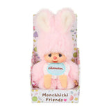 An officially licensed Chimutan bunny plush with fluffy pink fur and long ears, sitting inside a "Monchhichi Friends" decorative box. The plush is wearing a light blue bib with its name printed in red script.