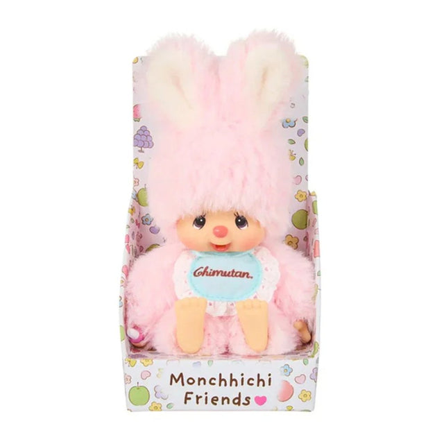 An officially licensed Chimutan bunny plush with fluffy pink fur and long ears, sitting inside a "Monchhichi Friends" decorative box. The plush is wearing a light blue bib with its name printed in red script.