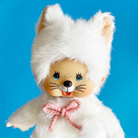 Officially licensed Monchhichi girl dressed in a full-body white cat suit complete with cat ears, tail, cat face. ㅖerfect collectible toy.