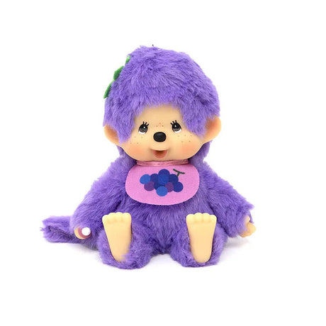 An officially licensed, Grape purple color , Grape -themed Monchhichi plush doll has a tan ABS face, brown eyes, freckles, wear a grape -print bib, and a green stem detail on its head. Monchhichi plush a soft, fluffy texture. Ideal for collection as a charming gift, or for home decor