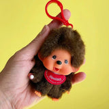 Meet Retro Monchhichi boy keychain ! Features Monchhichi signature red bib with pacifier-holding hand — he’s the perfect fun companion for your keys, bag, or backpack, and comes in an adorably tiny size that fits right in your hand! Perfect for keychain, bag decoration, room decoration or gift. 