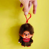 Meet Retro Monchhichi boy keychain ! Features Monchhichi signature red bib with pacifier-holding hand — he’s the perfect fun companion for your keys, bag, or backpack, and comes in an adorably tiny size that fits right in your hand! Perfect for keychain, bag decoration, room decoration or gift. 