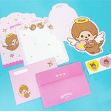 An officially licensed Monchhichi letter writing set displayed with die-cut stationary paper in pink and yellow themes, matching envelopes, and heart sealing stickers