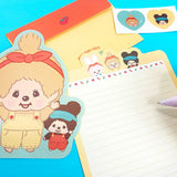 An officially licensed Monchhichi letter writing set displayed with die-cut stationary paper in pink and yellow themes, matching envelopes, and heart sealing stickers