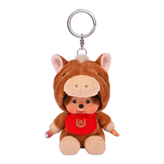An officially licensed Monchhichi plush keychain wearing a plush brown horse costume with a red horseshoe bib, suspended from a silver keyring