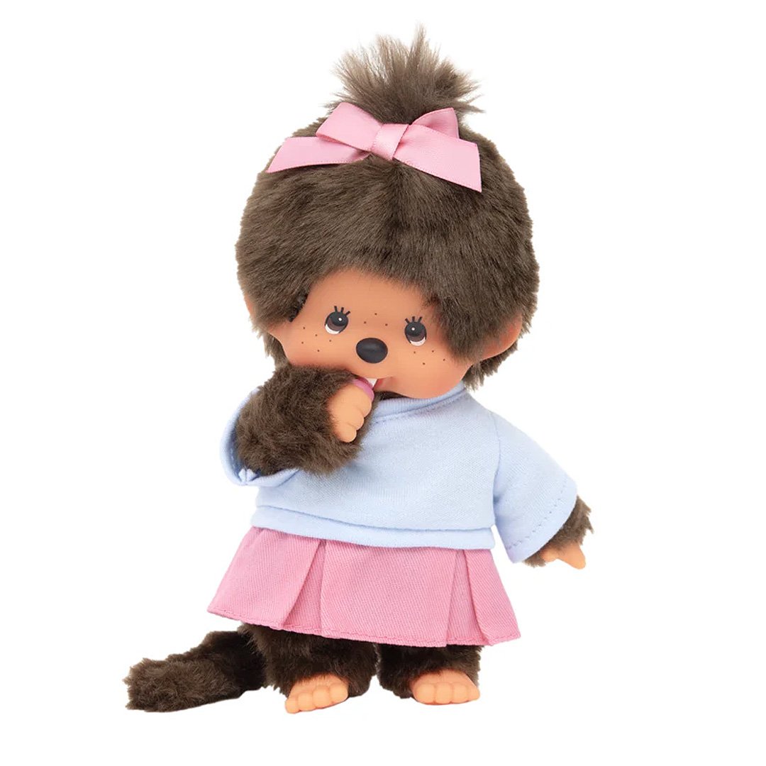 Official Licensed Monchhichi: She is wearing a cute pink pleated skirt, complemented by a matching ribbon in her hair and a soft pastel top and sucking her pacifier .