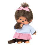 Official Licensed Monchhichi: She is wearing a cute pink pleated skirt, complemented by a matching ribbon in her hair and a soft pastel top and sucking her pacifier .