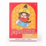 Monchhichi toy packaging with a monkey character on a skateboard against a red and yellow background.